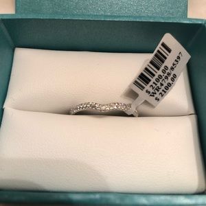 18k white gold .34 carat diamond band. Brand new.